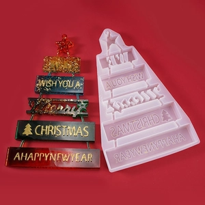 Christmas tree silicone mold and colorful resin craft with gold leaf on red background