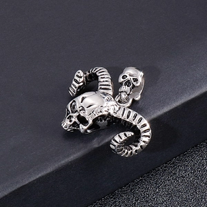 Close-up of a silver gothic ram skull pendant with a small skull on the top bail