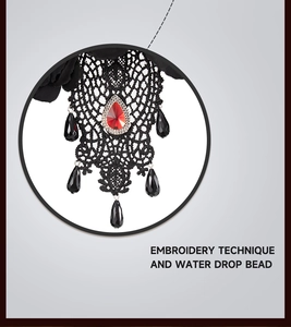 Detail of gothic lace embroidery and red teardrop beads on a Halloween headband