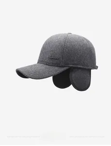 Detail of dark grey wool winter baseball cap with ear flaps and embossed SPORT logo