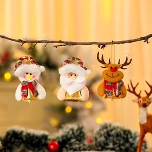 Christmas plush ornaments featuring Santa, snowman and reindeer with metal bells on a tree
