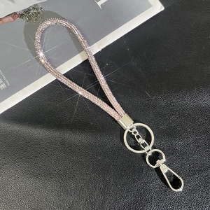 Macro view of the sparkling rhinestone handset strap with premium silver metal clasp