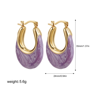 Detail shot showing 35mm height and 24mm width dimensions of gold U-shaped enamel earrings