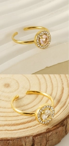 Macro shot of 18K gold plated double-layer ring with adjustable band and zircon accents