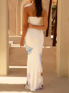 Elegant white strapless maxi dress with blue floral print for summer resort style