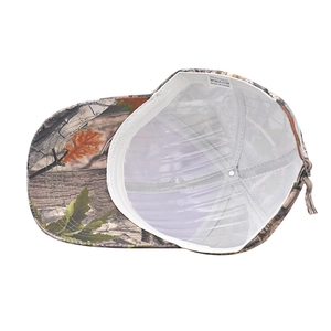 Detail view of leaf camouflage baseball cap interior with polyester sweatband and label