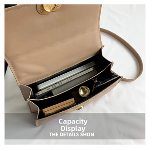 Interior view of small crossbody bag showing two main compartments with phone and lipstick