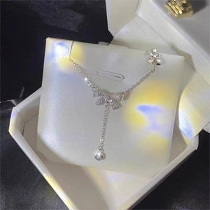 S925 sterling silver bow necklace with zircon tassel pendant in a jewelry box