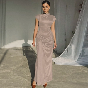 Close-up of champagne satin dress showcasing detailed waist ruching and elegant drape