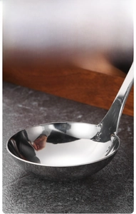 Close-up of polished stainless steel soup ladle with deep head and smooth edges