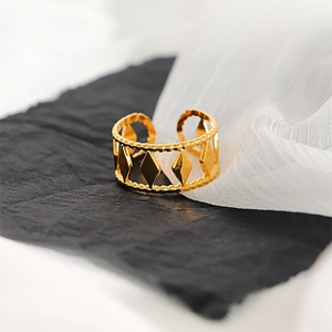 Detail of 18k gold plated stainless steel ring with diamond and bead patterns