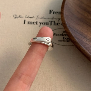 Close-up of S925 sterling silver smile face open ring with vintage design details