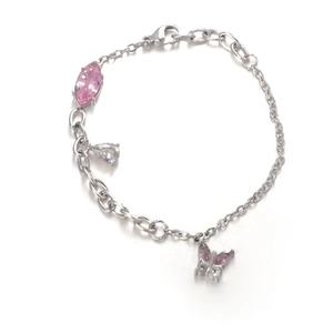 Elegant silver bracelet with pink zircon butterfly and marquise stone charms on white base