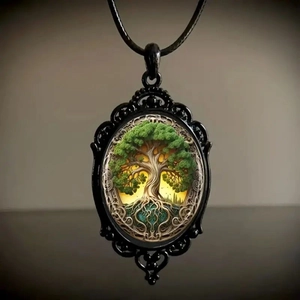Macro shot of vintage gothic oval pendant featuring an embossed tree of life design