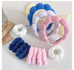 Detailed set of twisted plush spa headbands and matching wristbands in soft towel fabric