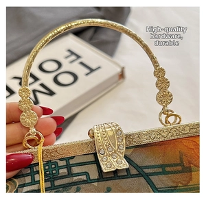 Macro view of Chinese retro handbag with gold floral handle and rhinestone buckle details