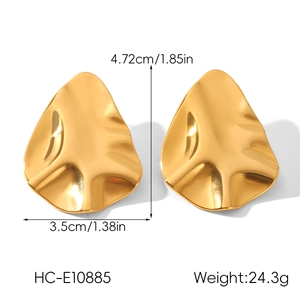 Detail view of 18k gold hammered irregular triangle earrings with size and weight specs