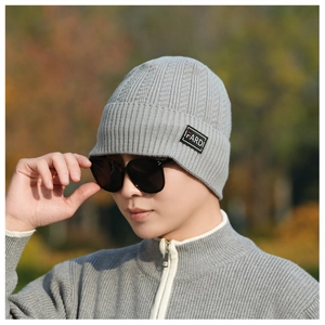 Detail of grey ribbed knit beanie with IFARDI letter patch for winter warmth