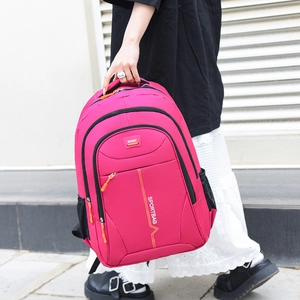 Waterproof hot pink backpack with sports lettering and multiple zipper compartments