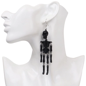 Detail of long black poseable skeleton earrings on model showing length and fit