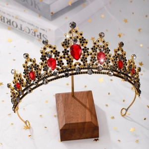 Detailed macro view of baroque bridal crown with red drop crystals and black rhinestones