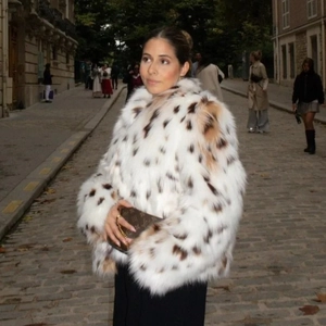 Women's faux fur jacket in white with brown spots, outdoor street style fashion view