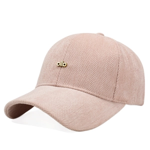 Pink herringbone baseball cap with gold metal logo for a cozy autumn winter style