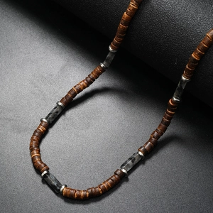 Men's coconut shell beaded necklace with wood and stone beads on a black background