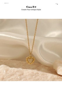 Detail of vintage heart necklace with 14K gold chain and shimmering moonstone pendant