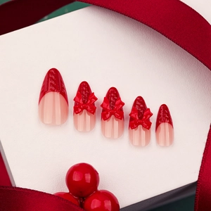 3D bow festive French press-on nails with red sweater texture and long stiletto shape