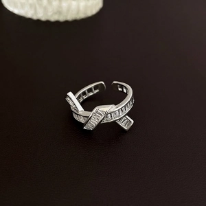 Silver open adjustable ring with bowknot heart design and rectangular zircon stones