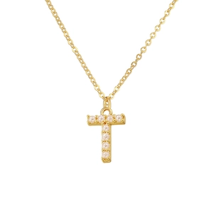 Close-up of golden necklace with T-letter pendant set with elegant white pearls