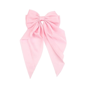 Pink satin hair bow with long streaming ribbons on a clean white background