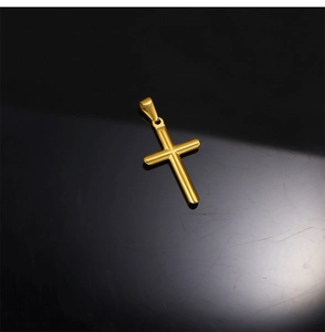 Polished 24k gold-plated stainless steel cross pendant on reflective black background