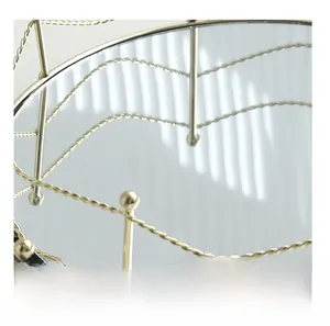 Detail of light gold geometric metal frame and high-definition mirrored glass tray base