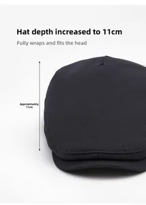Detailed view of the dark grey newsboy cap showing fine mesh texture and 11cm depth