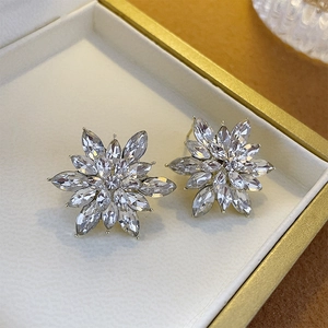 Close-up of double-layer marquise-cut crystal flower stud earrings in a jewelry box