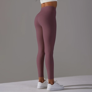 Detail of high waisted yoga leggings in dark mauve with seamless push up effect