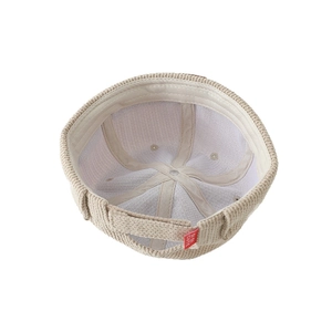 Beige corduroy docker hat for boys featuring a cute bear patch and adjustable velcro strap