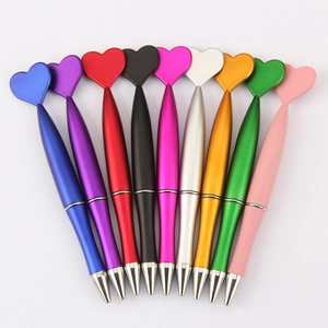 Rainbow set of 9 creative heart-shaped metal pens in a fan-like arrangement