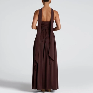 Detail view of the backless chocolate brown maxi dress featuring long neck ribbons