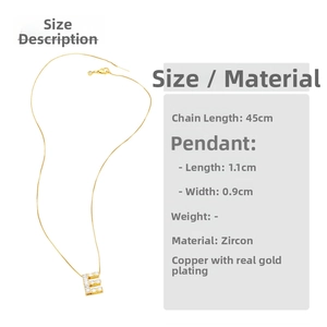 Detail view of gold letter E pendant with dimensions 1.1x0.9cm and 45cm chain length
