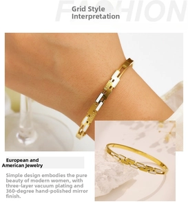 Detail showing the LOVE inscription on a golden titanium steel bracelet with enamel