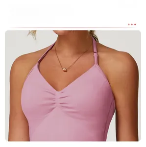 Detail of pink ruched front halter yoga top with deep V-neckline and elastic fit