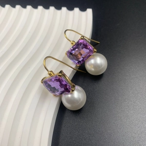 Vintage style gold plated drop earrings featuring square purple gems and round pearls