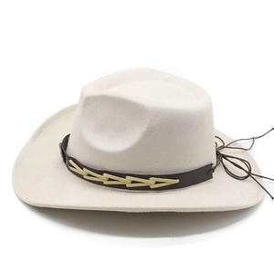 Detail of western cowboy hat with brown leather band and white woven patterns