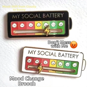 Detail showing the sliding metal lightning bolt on the My Social Battery mood enamel pin