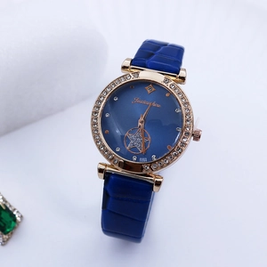 Macro view of blue dial with rose gold crystal bezel and starry镂空 pattern detailing