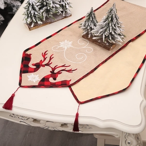 Christmas burlap table runner with reindeer silhouettes and red plaid border for decor