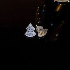Detailed view of silver fan-shaped earrings with sparkling cubic zirconia inlays